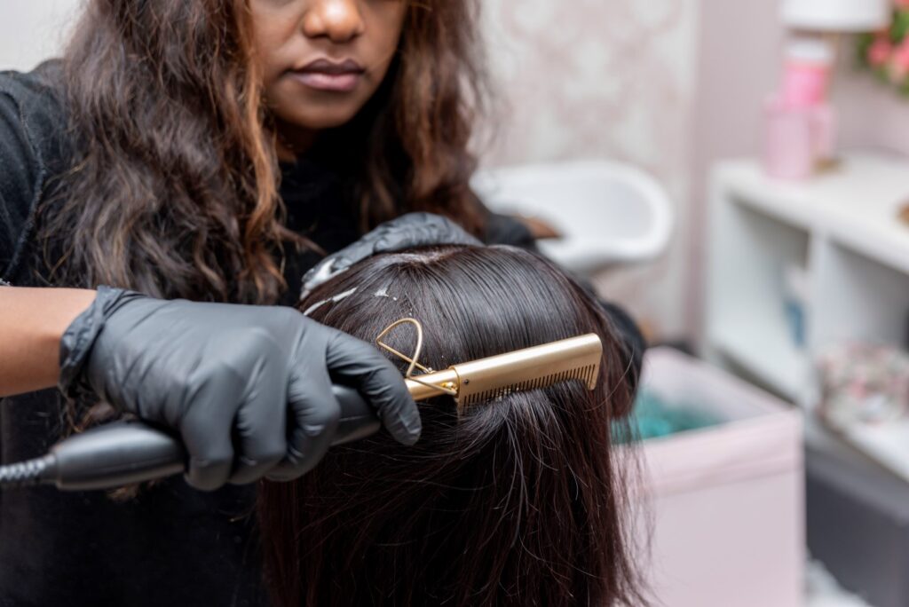hairdresser straightening hair
