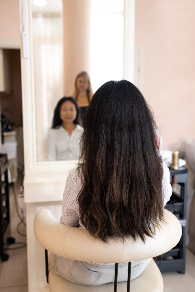 Client consultation before hair straightening service.